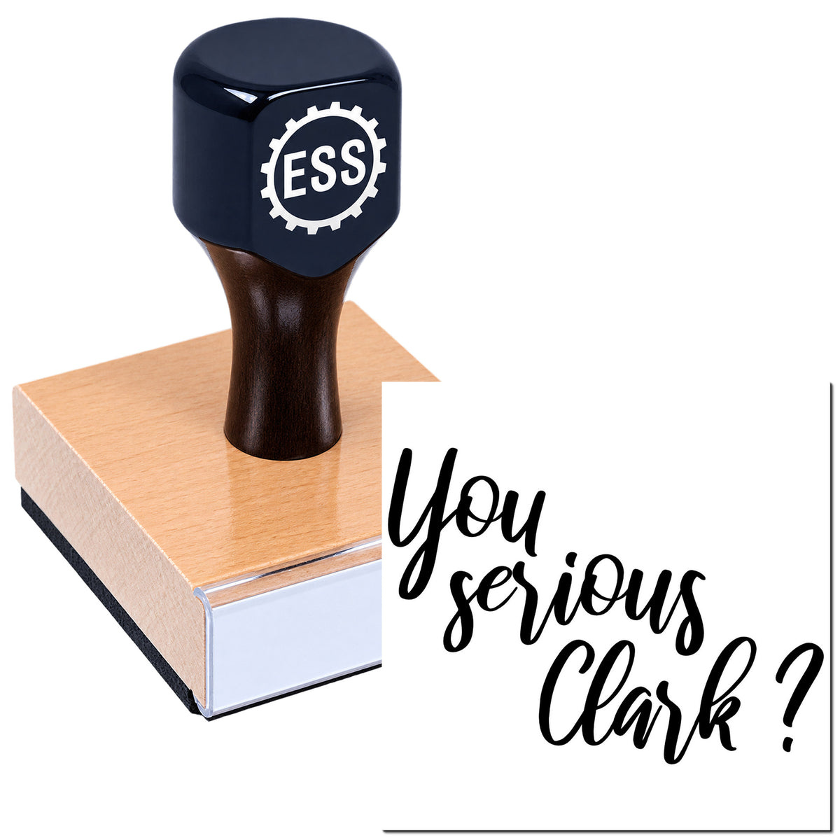 Black ESS self-inking stamp on a tan seal block with white backing and script text, "You serious Clark?"