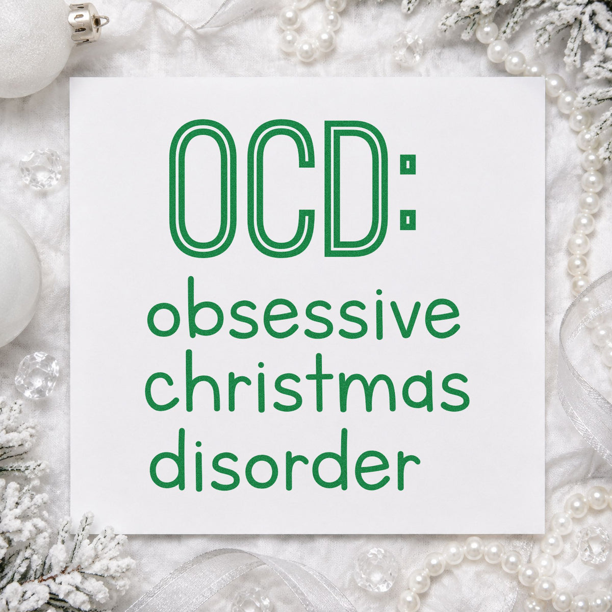 Obsessive Christmas Disorder craft stamp imprint in green ink on a handmade project, one idea being collection gift tags.