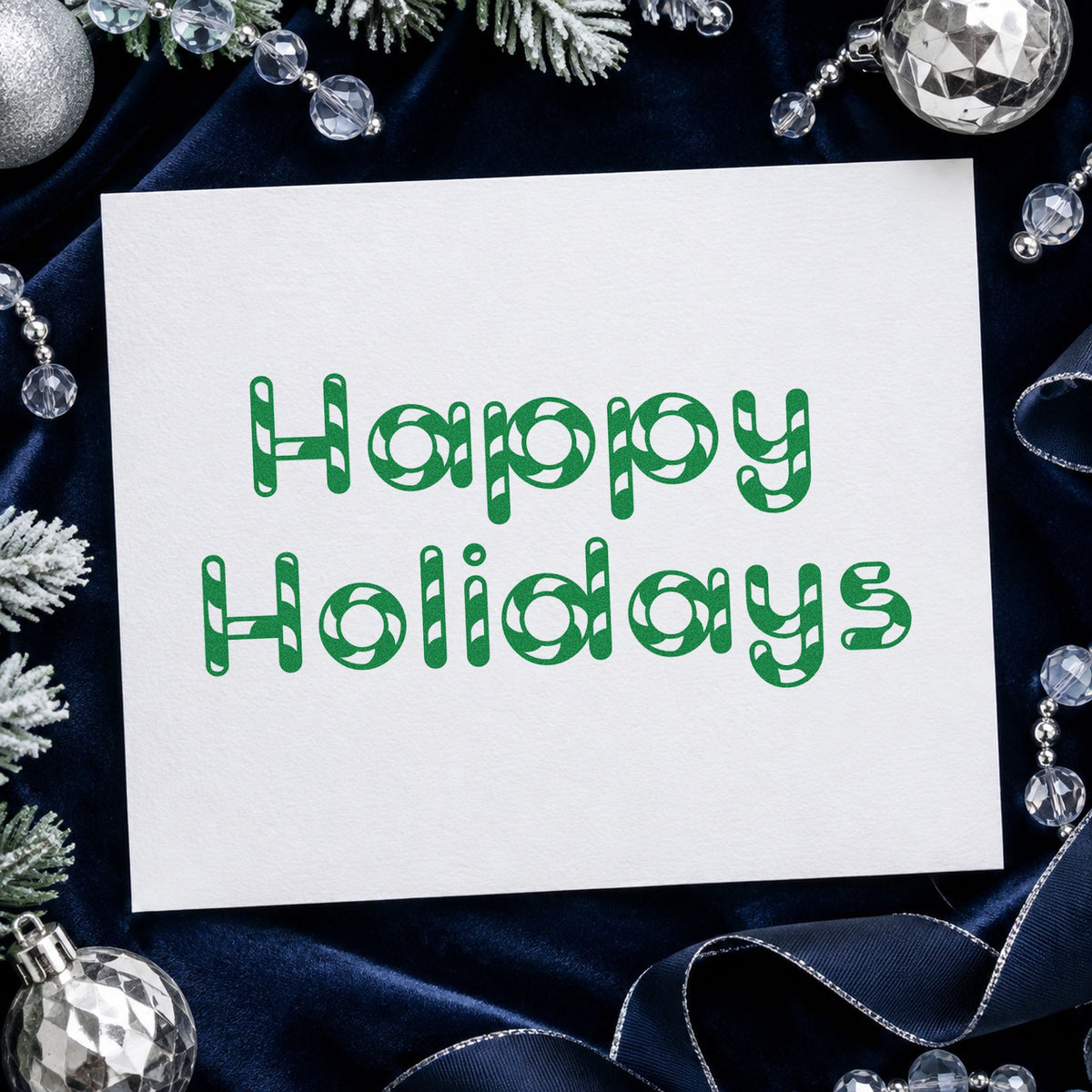 Happy Holidays Patterned Letters craft stamp imprint in green ink on a handmade project, one idea being color in gift tags.