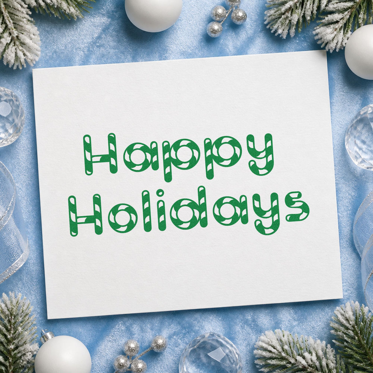 Happy Holidays Patterned Letters craft stamp imprint in green ink on a handmade project, one idea being party favor sheets.
