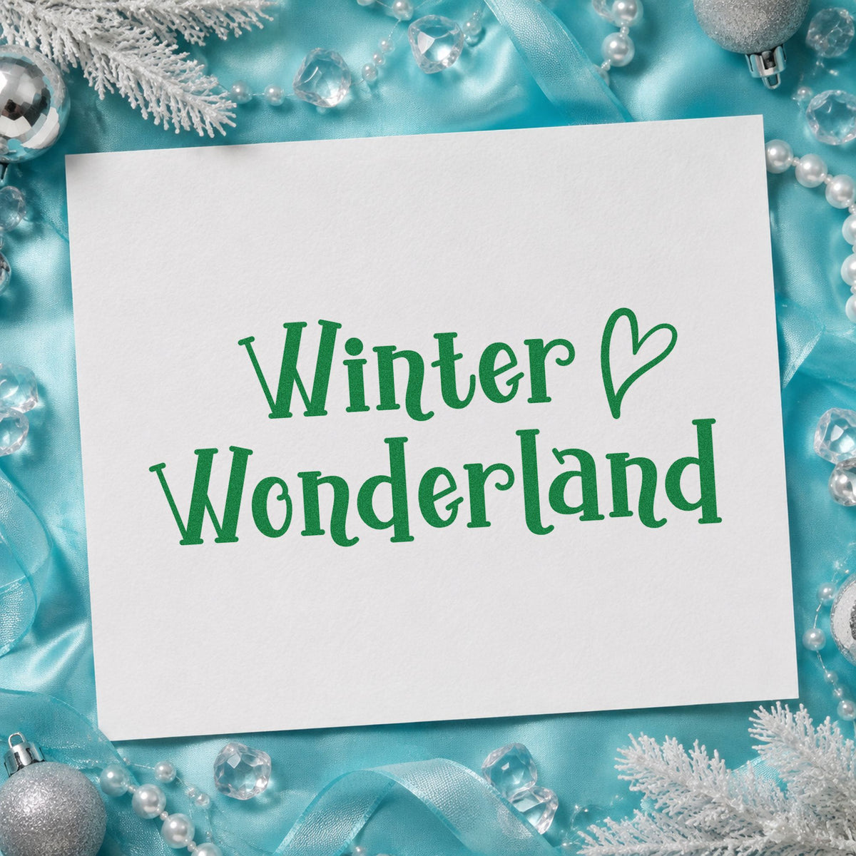 Winter Wonderland Heart craft stamp imprint in green ink on a handmade project, one idea being solstice dinner menus.