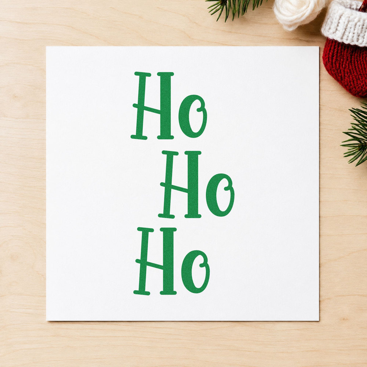 Three Stacked Ho Words craft stamp imprinted in green ink on paper, a design suited to framed stagger print.
