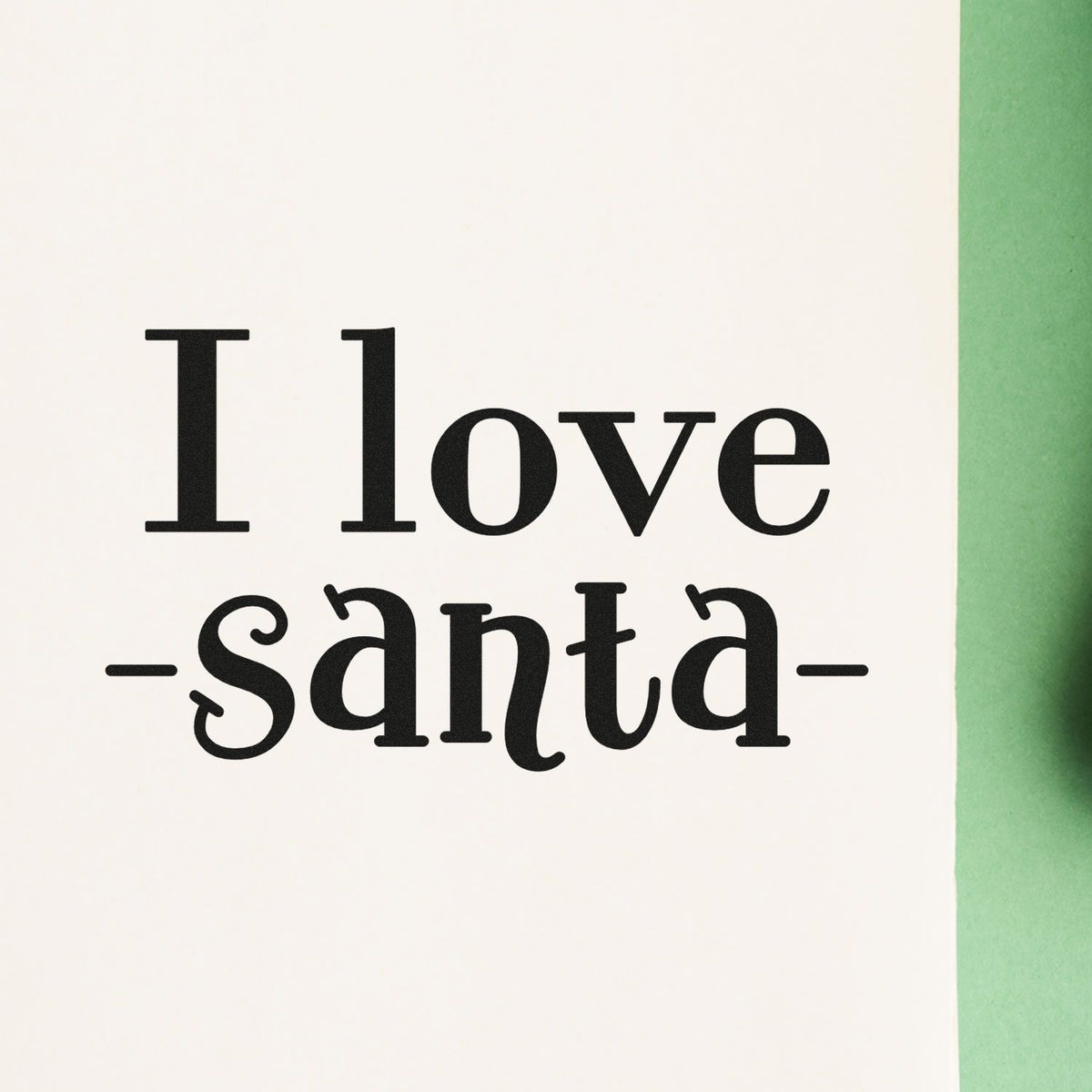Black I love Santa stamp/seal design on white paper with a green border.