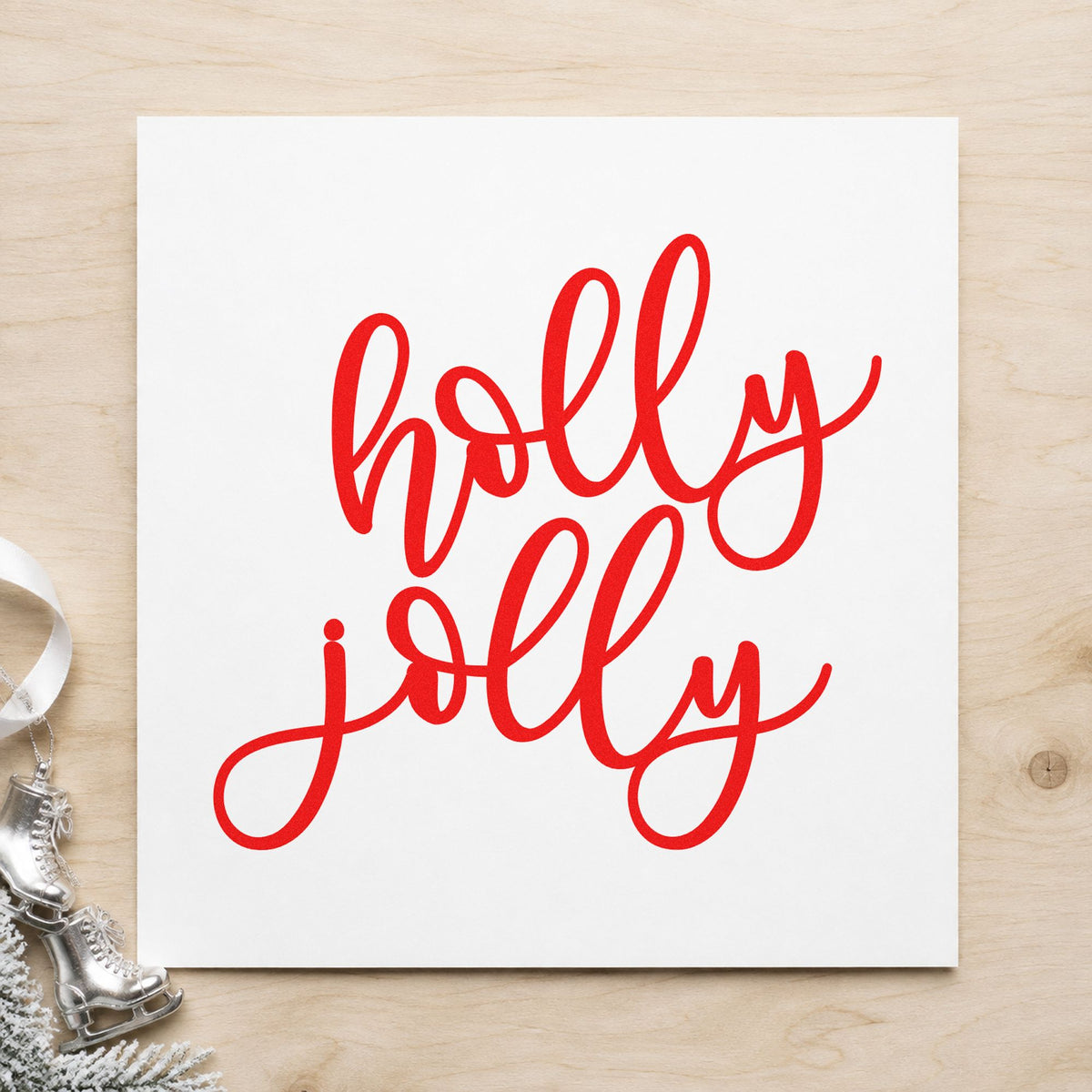 Holly Jolly Script craft stamp in red ink on cardstock, an easy option for cushion cover printing.