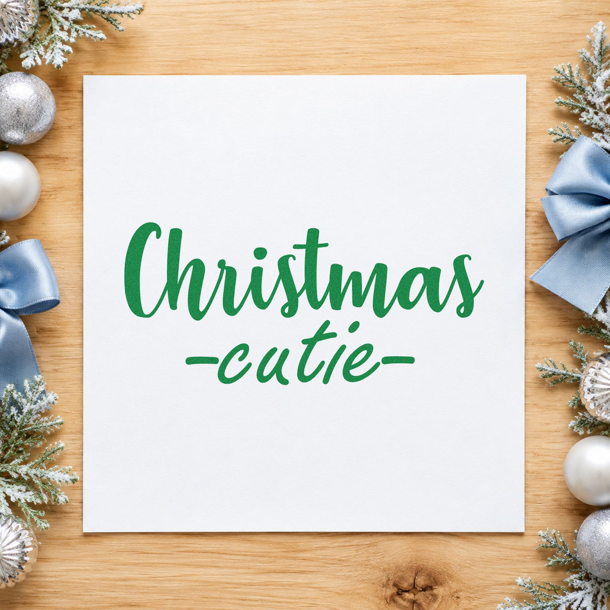 Christmas Cutie Script craft stamp imprint in green ink on a handmade project, one idea being bow hair clip tags.