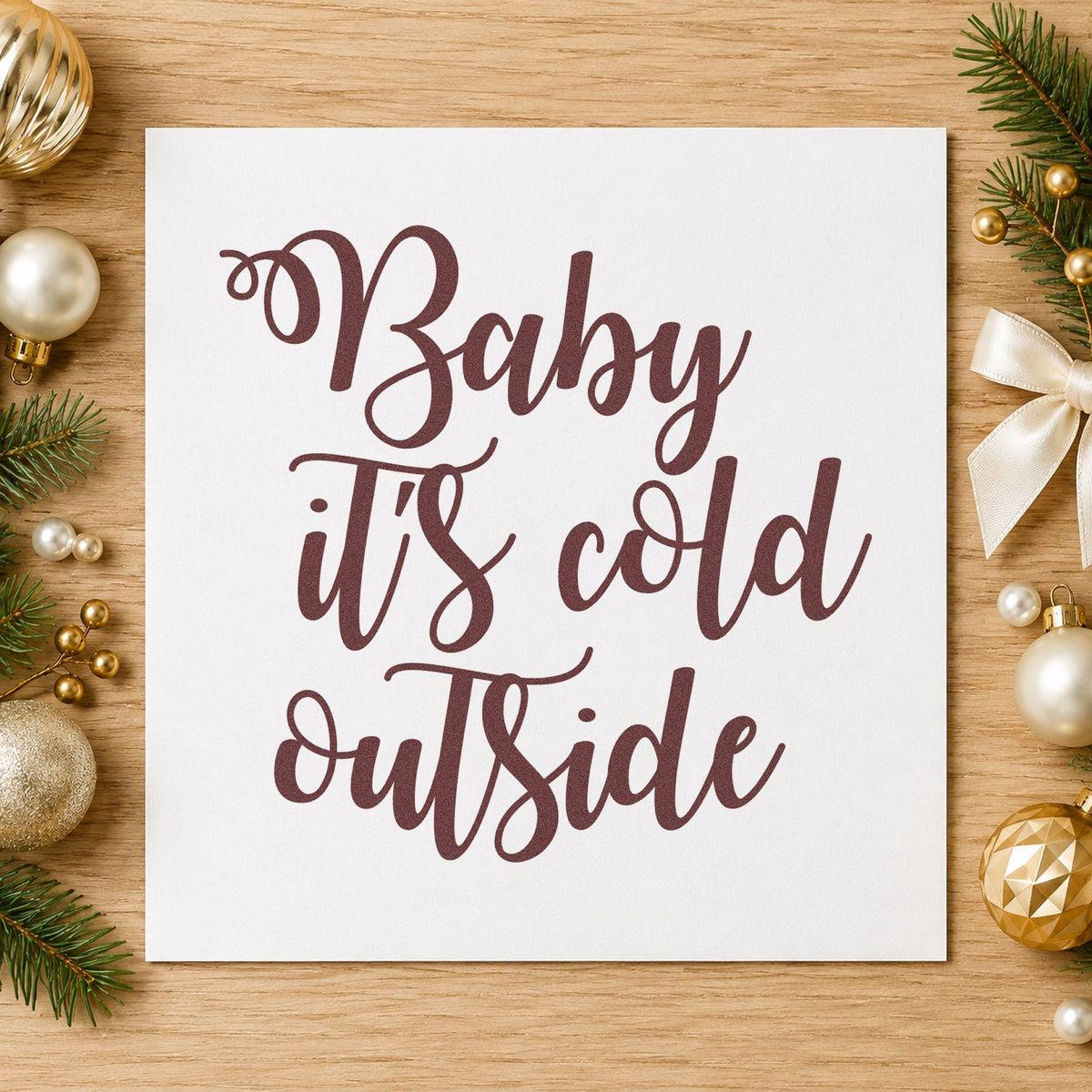 Baby It's Cold Outside Script rubber stamp printed in brown ink, ready for heating log sheet and similar paper crafts.