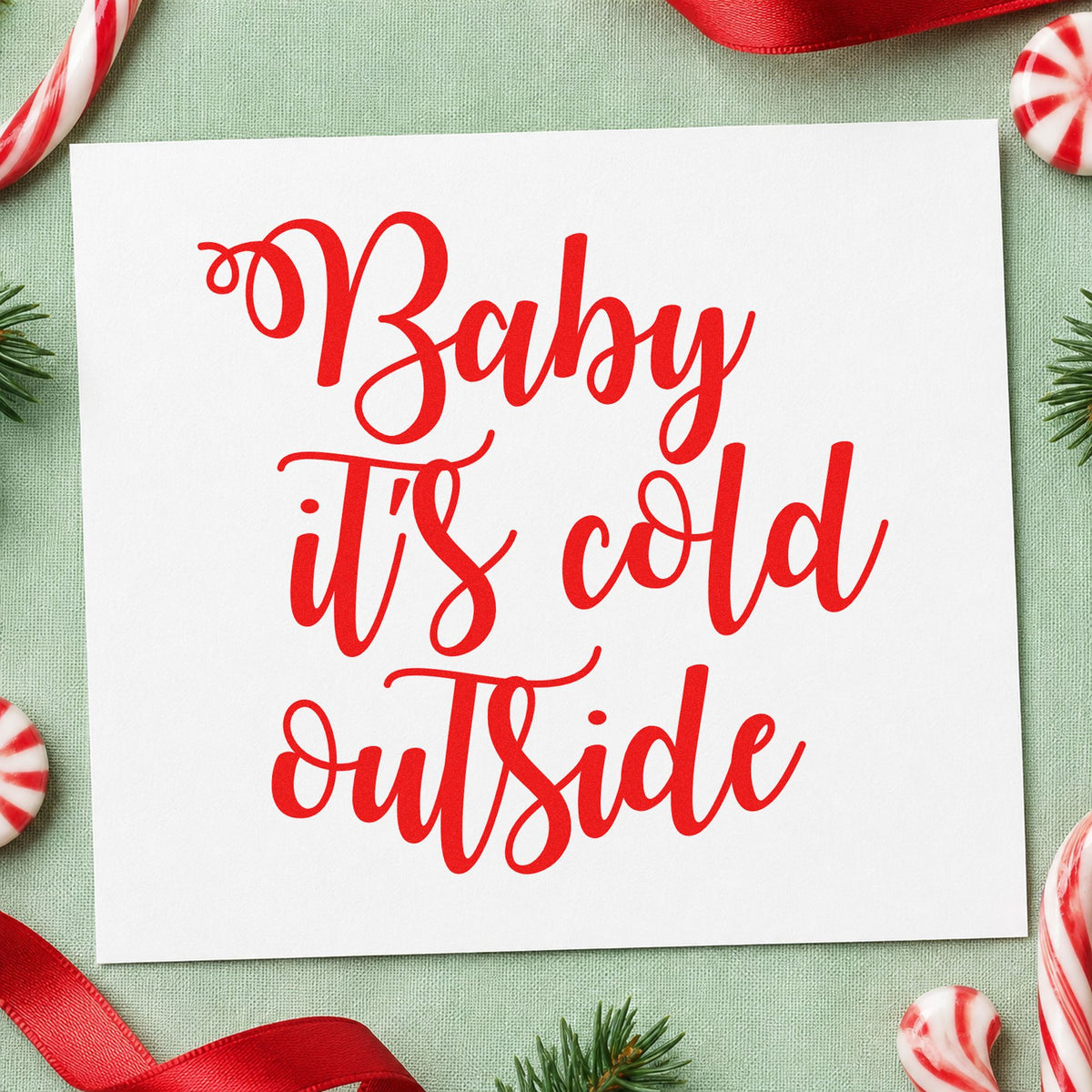 Baby It's Cold Outside Script rubber stamp shown in red ink, stamped for projects such as salt bucket labels.