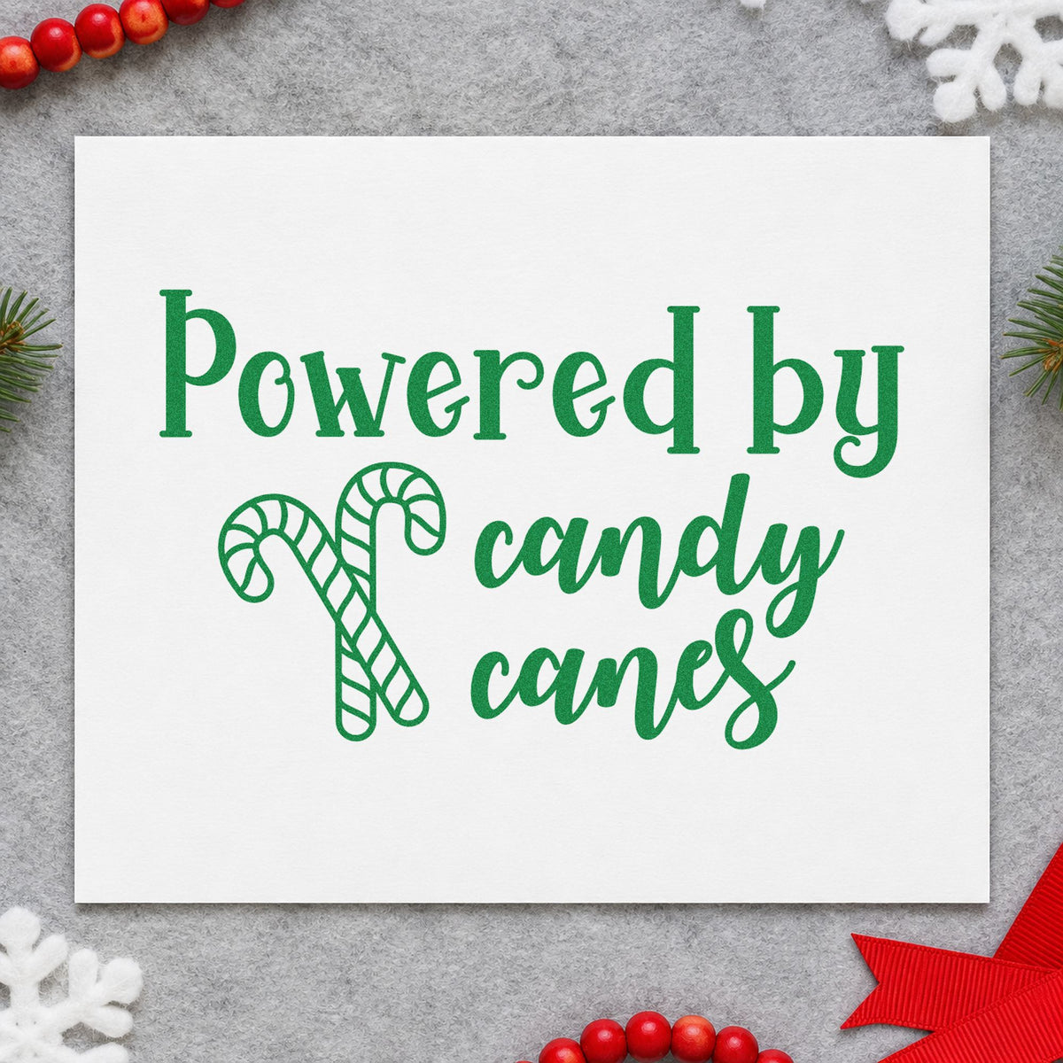 Powered By Candy Canes craft stamp imprinted in green ink on paper, a design suited to framed sweet shop wall.