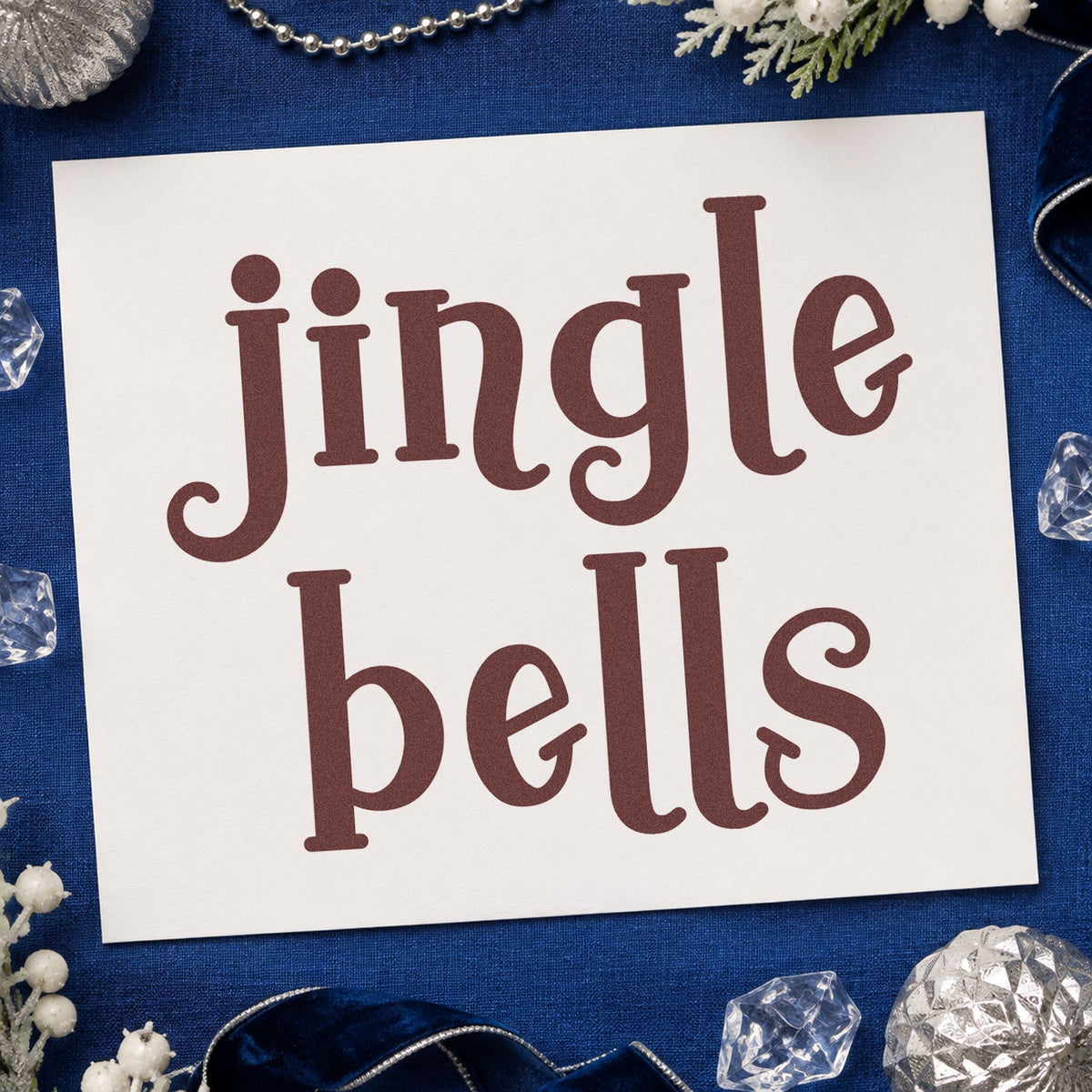 Jingle Bells Serif rubber stamp printed in brown ink, ready for assignment chart sheet and similar paper crafts.