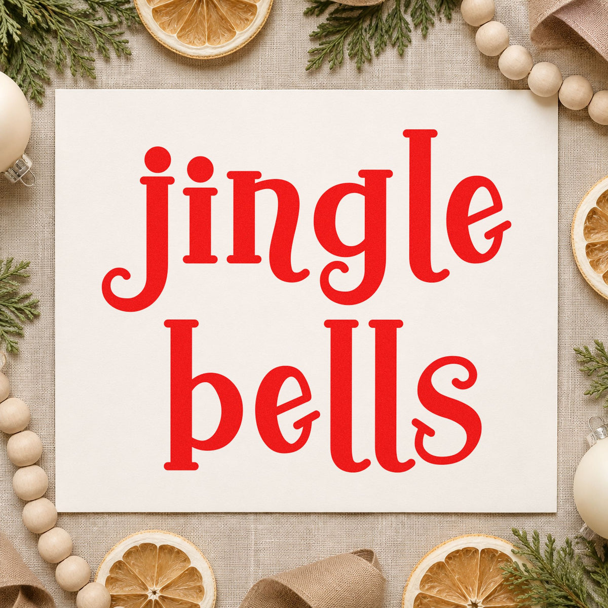 Jingle Bells Serif craft stamp in red ink on cardstock, an easy option for glove pair printing.