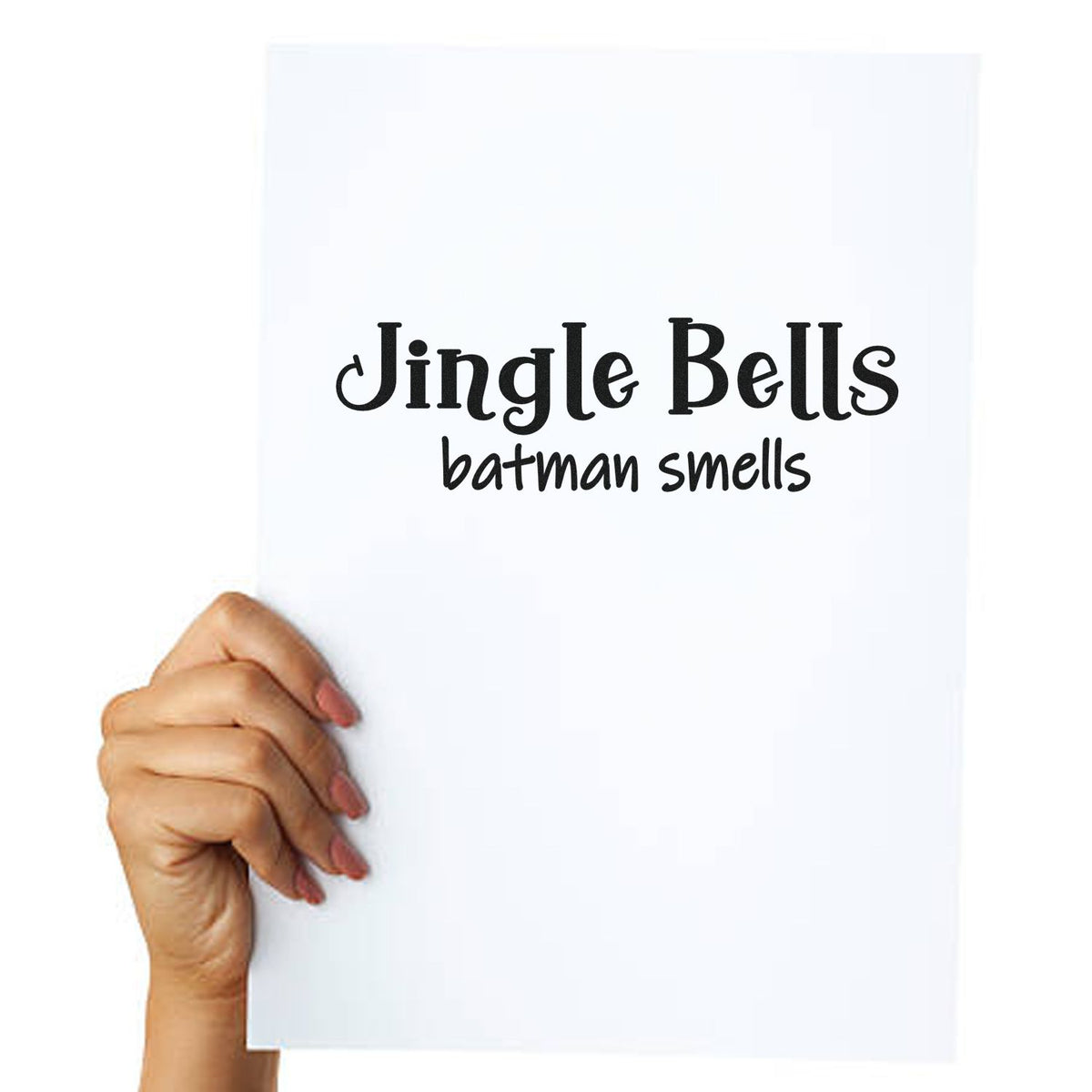 Hand holding white custom stamp seal with black Jingle Bells batman smells text.