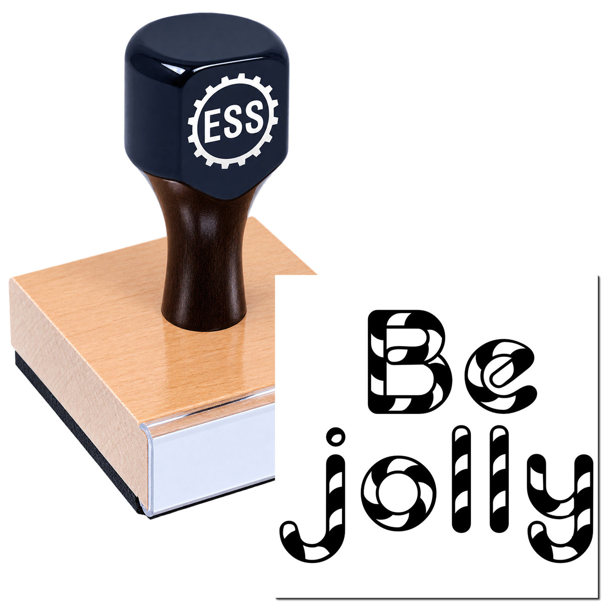 Navy blue ESS rubber stamp seal on a wooden block, with black "Be jolly" lettering.