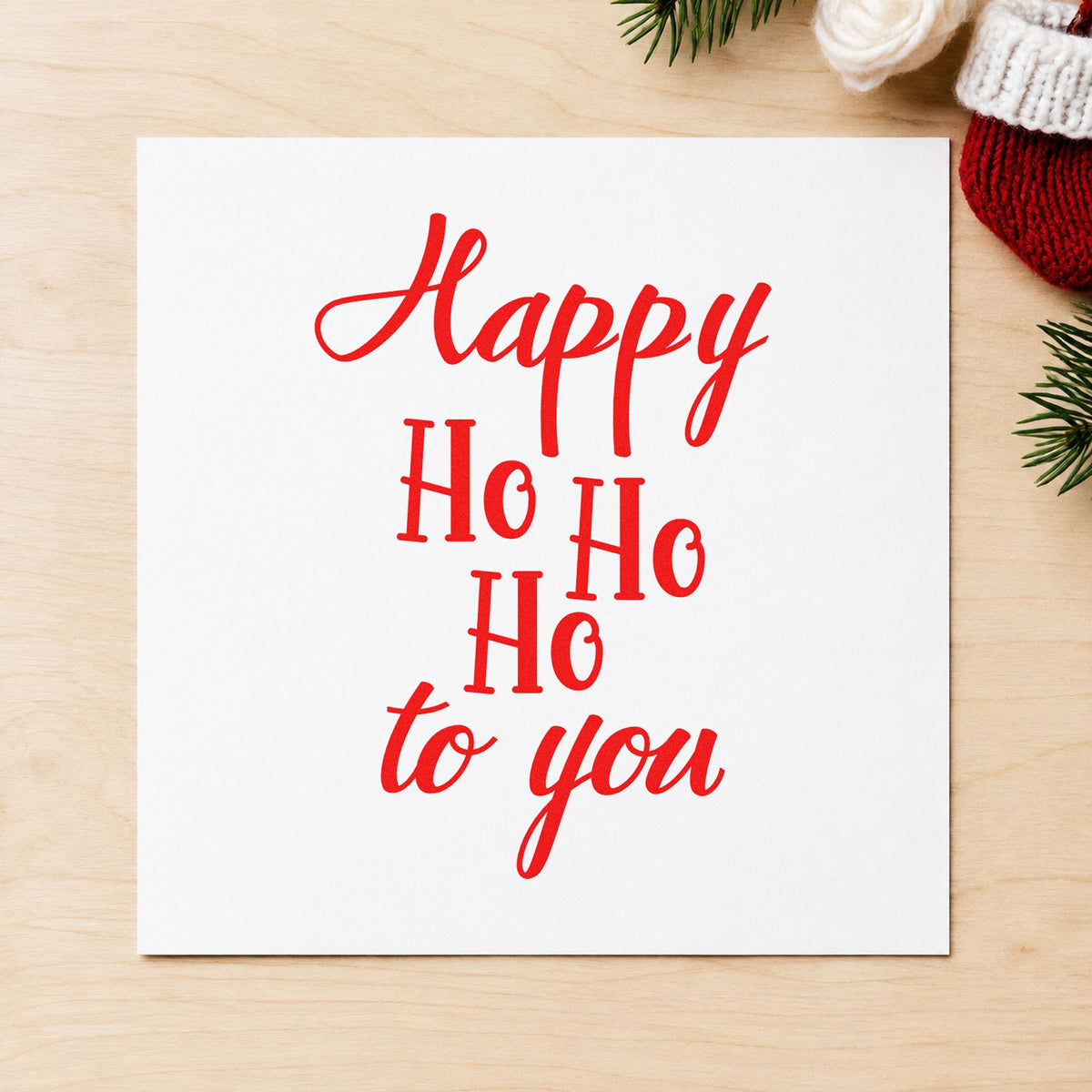 Happy Ho Ho Ho To You craft stamp in red ink on cardstock, an easy option for runner length printing.