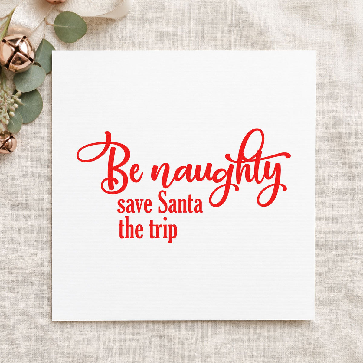 Be Naughty Save Santa Trip craft stamp in red ink on cardstock, an easy option for robe sleeve printing.