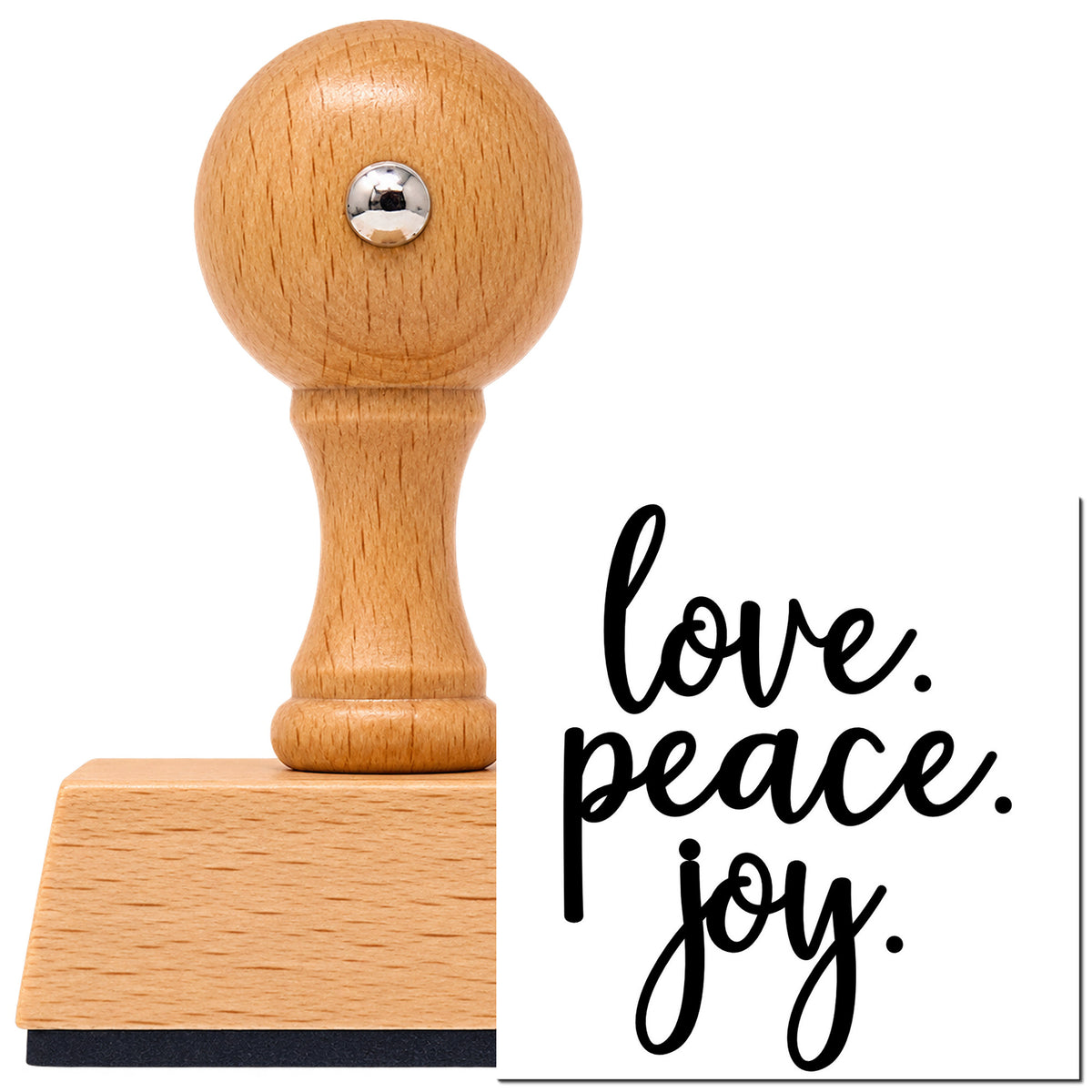 Vintage Pro beech wood stamp with a round knob handle, shown with its black Love. Peace. Joy imprint on white.
