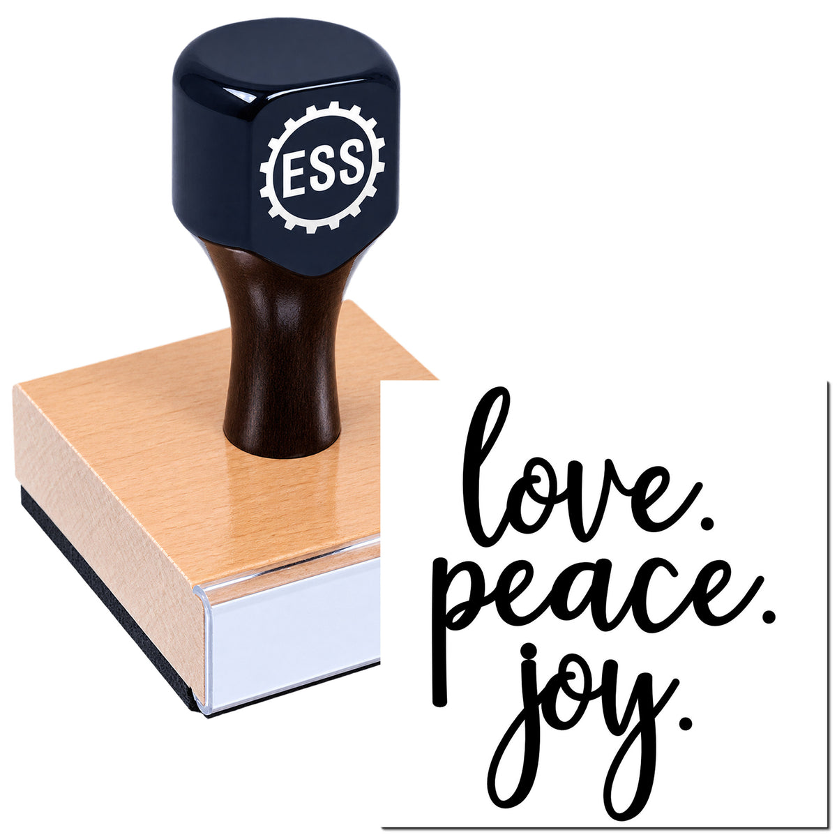 Dark navy ESS stamp on a wooden block beside a white seal reading "love, peace, joy" in black script.