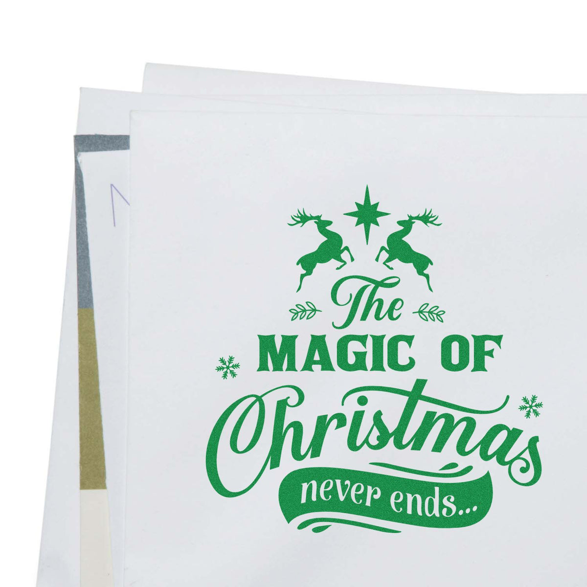Green Christmas stamp and seal sheets with reindeer, star and The Magic of Christmas never ends design.