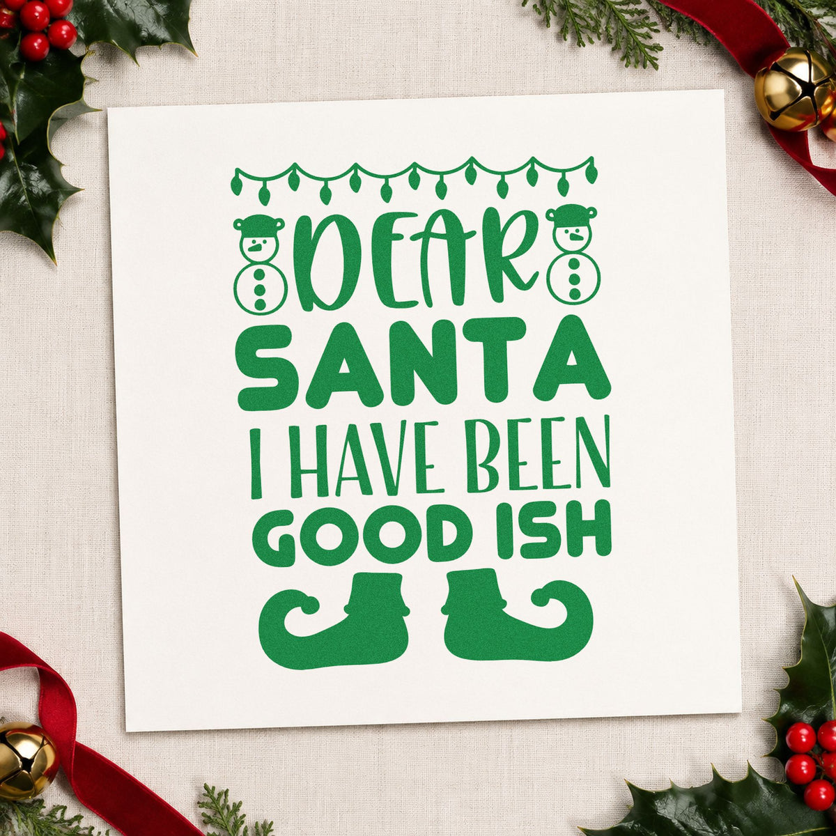 Dear Santa Good Ish craft stamp imprinted in green ink on paper, a design suited to christmas morning tees.