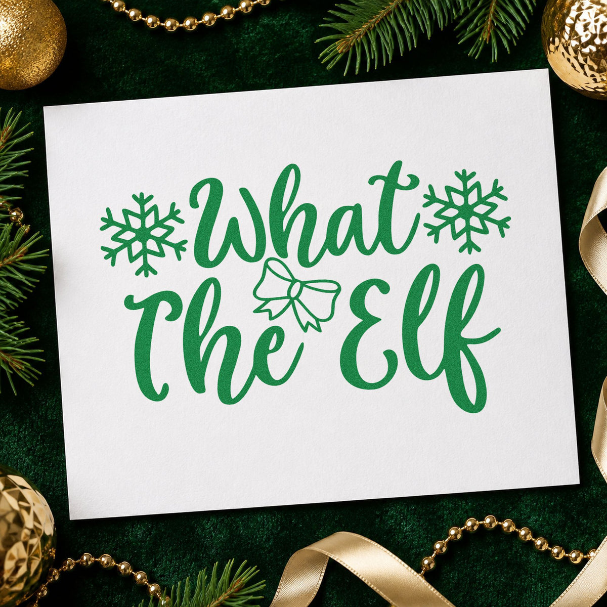 What The Elf Snowflakes craft stamp imprint in green ink on a handmade project, one idea being reaction gift tags.