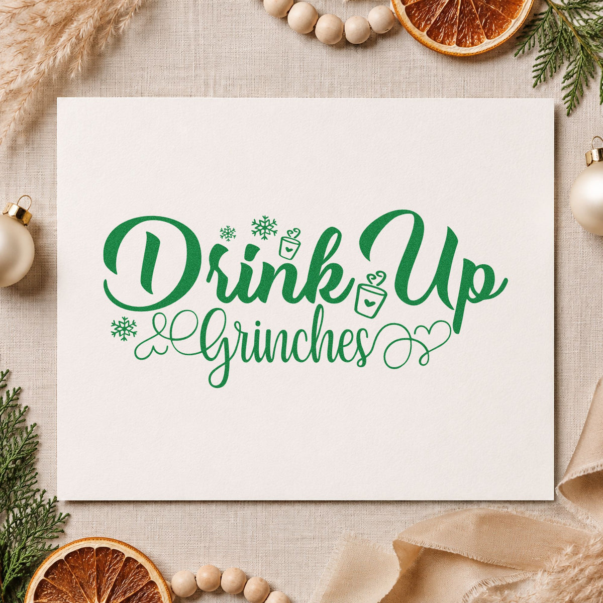 Drink Up Grinches craft stamp imprinted in green ink on paper, a design suited to framed drinks corner.