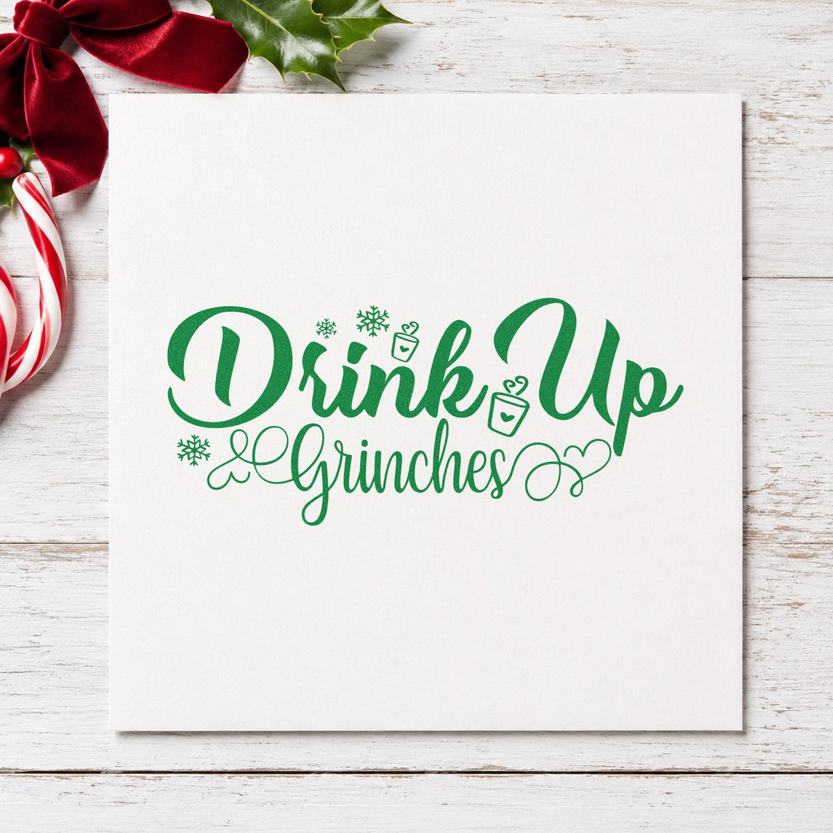 Drink Up Grinches craft stamp imprint in green ink on a handmade project, one idea being theme night invites.