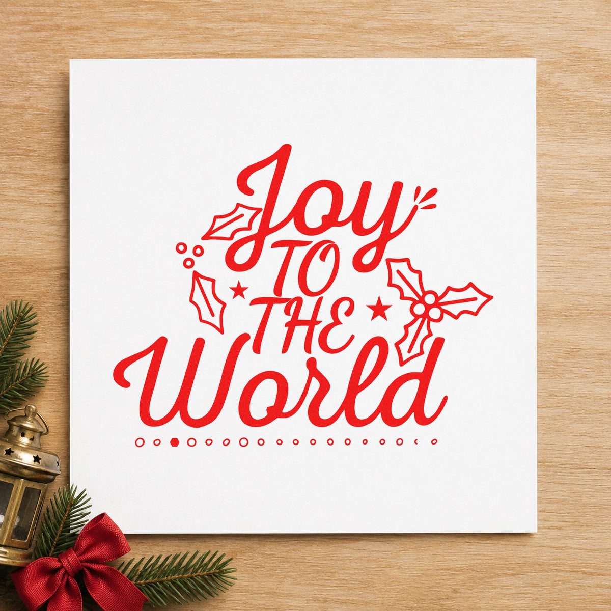 Joy To The World Holly craft stamp in red ink on cardstock, an easy option for tour shirt printing.
