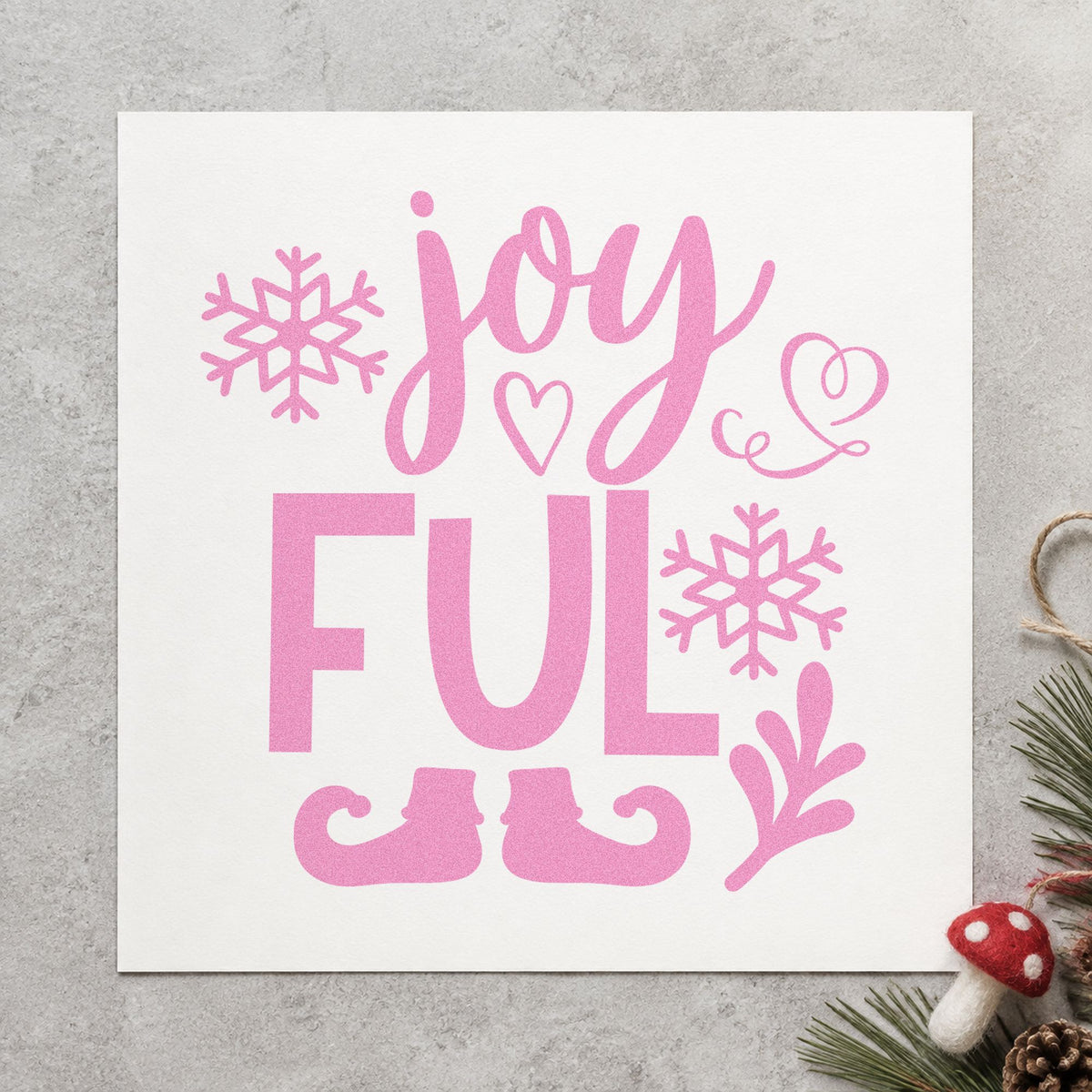 Joyful Elf Boots Snowflakes craft stamp in purple ink on cardstock, an easy option for stacked album header.