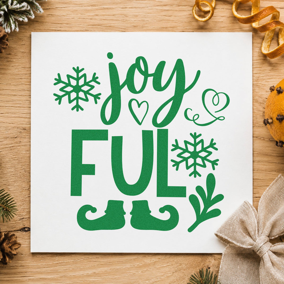 Joyful Elf Boots Snowflakes craft stamp imprint in green ink on a handmade project, one idea being short wide gift tags.
