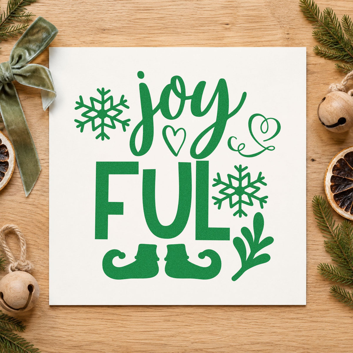 Joyful Elf Boots Snowflakes craft stamp imprint in green ink on a handmade project, one idea being station sign placards.