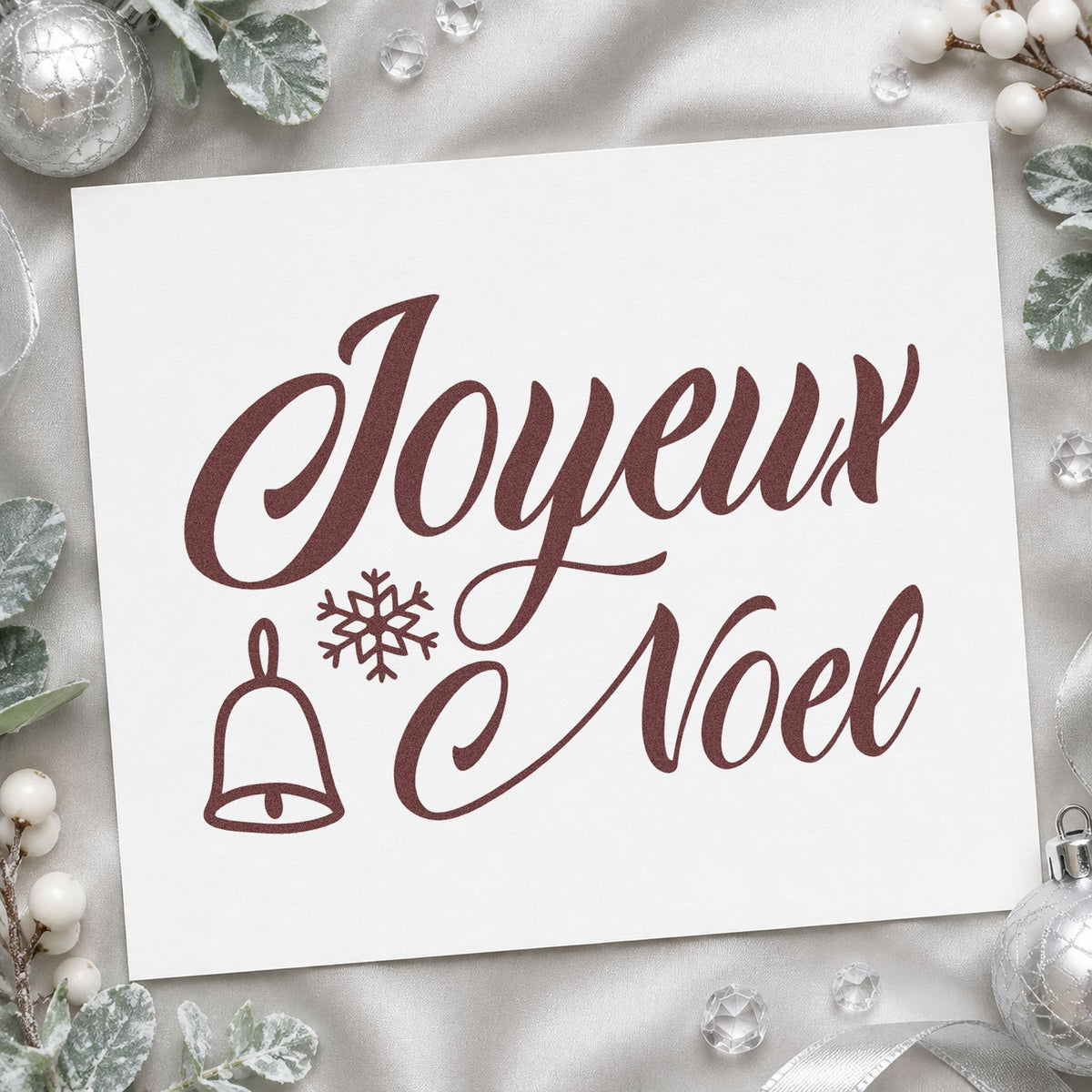 Joyeux Noel Bell Snowflake rubber stamp printed in brown ink, ready for language study sheet and similar paper crafts.