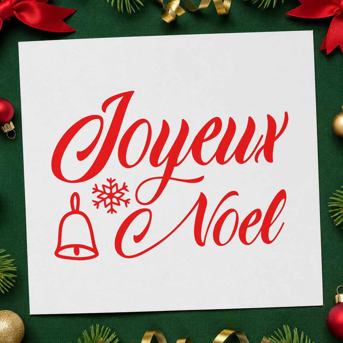 Joyeux Noel Bell Snowflake craft stamp in red ink on cardstock, an easy option for linen towel printing.