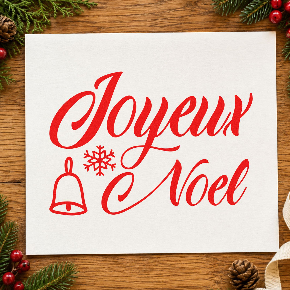 Joyeux Noel Bell Snowflake rubber stamp shown in red ink, stamped for projects such as confiture jar labels.