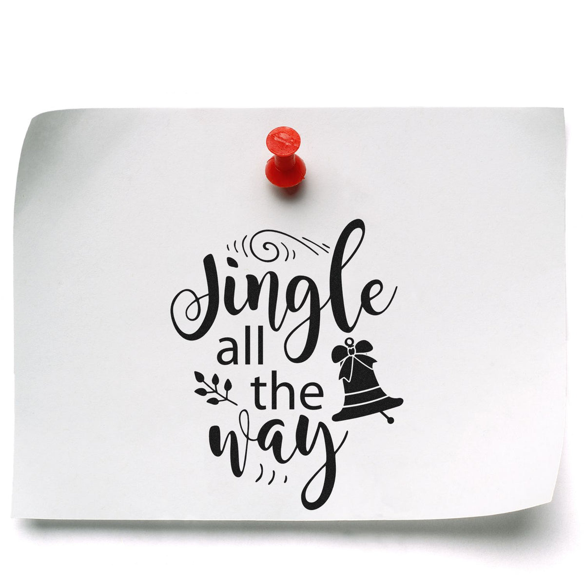 White paper stamp seal with red pin, black Jingle all the way lettering and bell graphic.