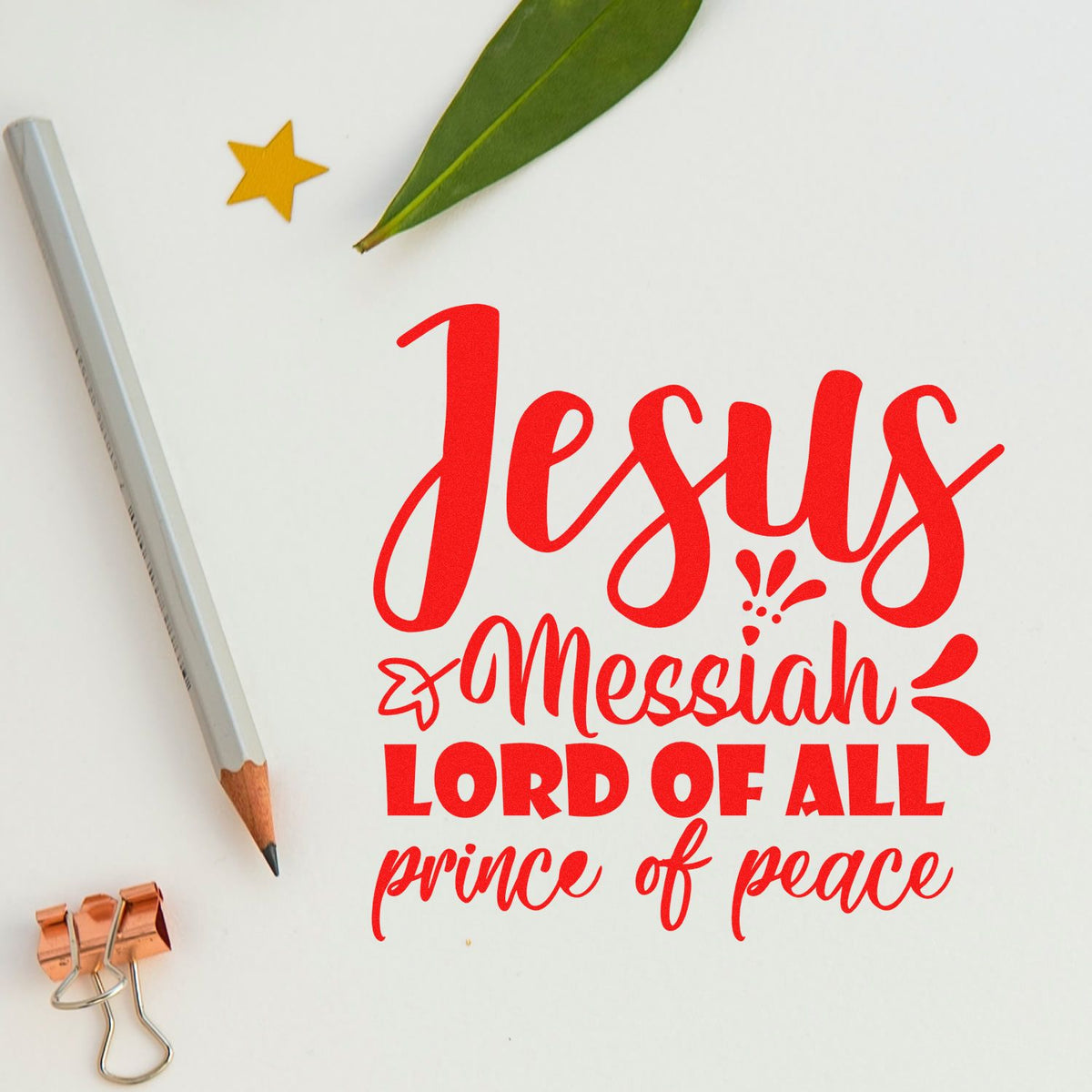 Red Christian stamp and seal design reading Jesus Messiah, Lord of All, Prince of Peace on white, with pencil, leaf, star and clip.