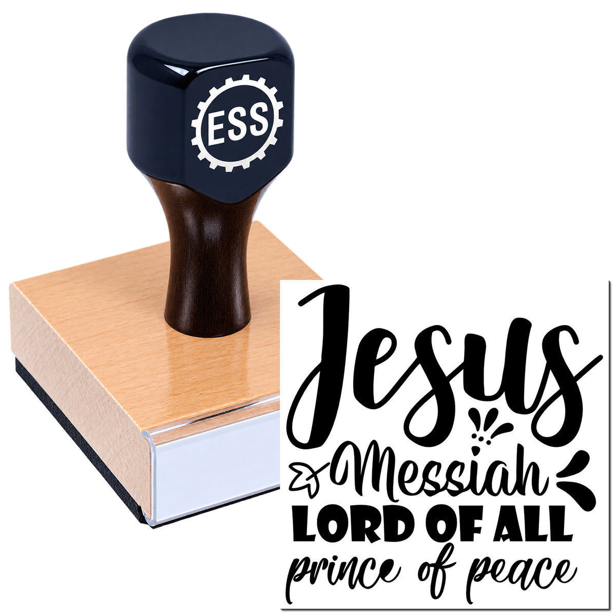 Black stamp handle on a wooden seal block, imprinting a bold "Jesus Messiah" religious design in black.