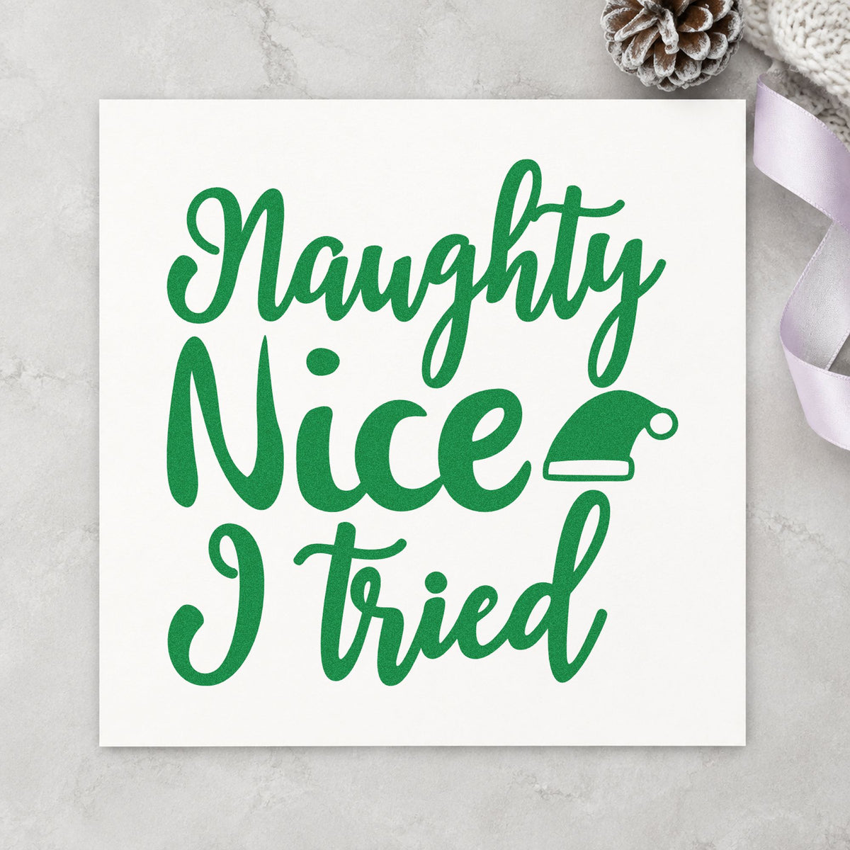 Naughty Nice I Tried Hat craft stamp imprint in green ink on a handmade project, one idea being good enough tags.