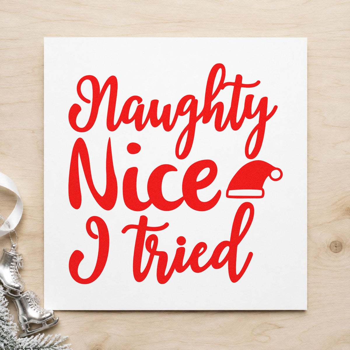 Naughty Nice I Tried Hat craft stamp in red ink on cardstock, an easy option for sweatpants leg ink.