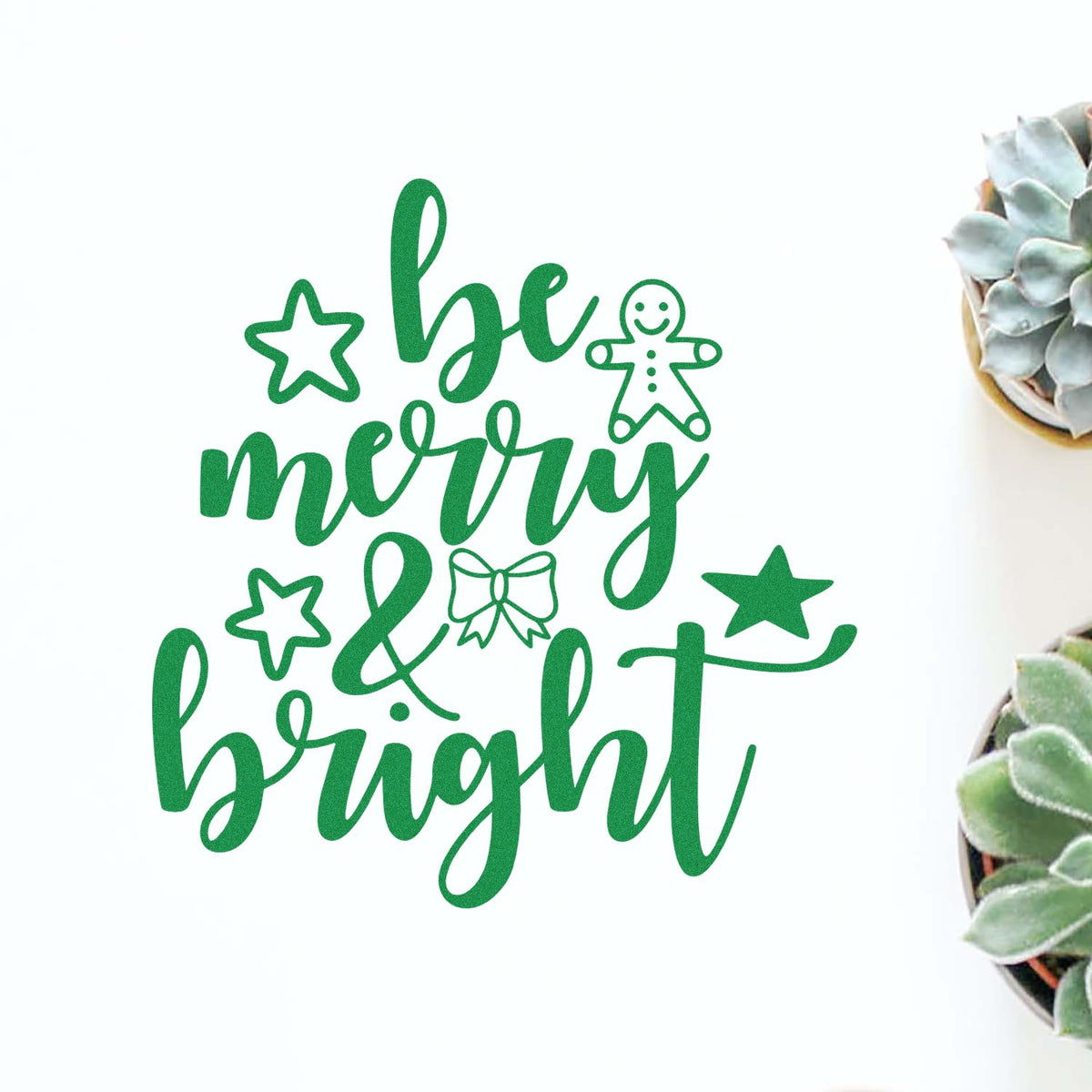 Green holiday stamp and seal design reading be merry & bright with stars, gingerbread figure, and bow on white background.
