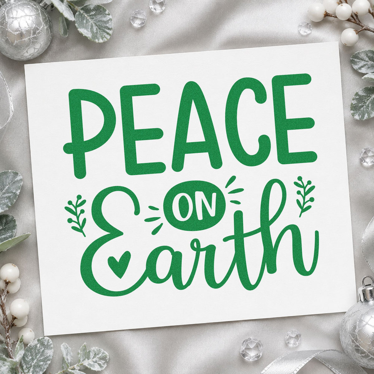 Peace On Earth Heart craft stamp imprinted in green ink on paper, a design suited to framed map wall.