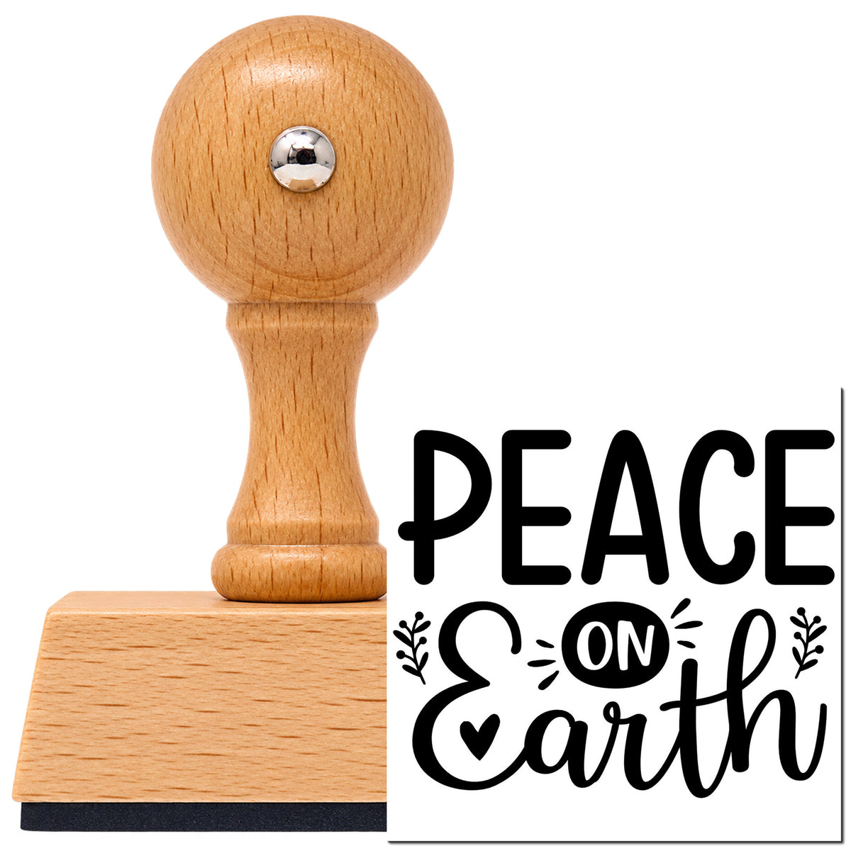 Vintage Pro beech wood stamp with a round knob handle, shown with its black Peace On Earth Botanical Sprig imprint on white.