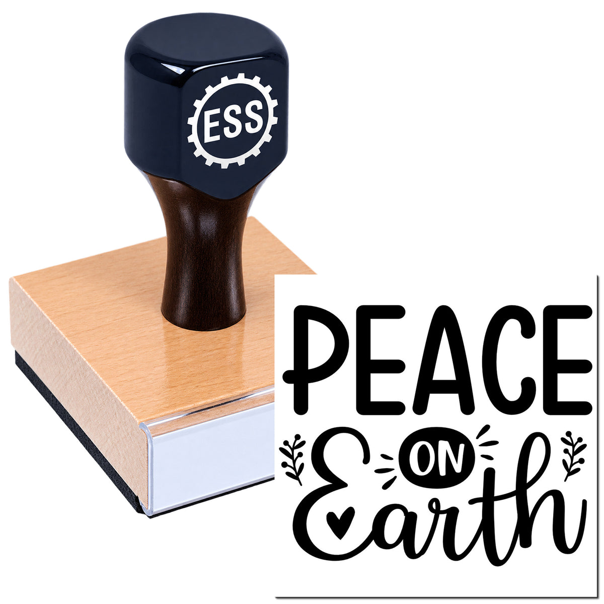Black ESS rubber stamp and seal on wooden block with copper-toned base, stamped "Peace on Earth" design.