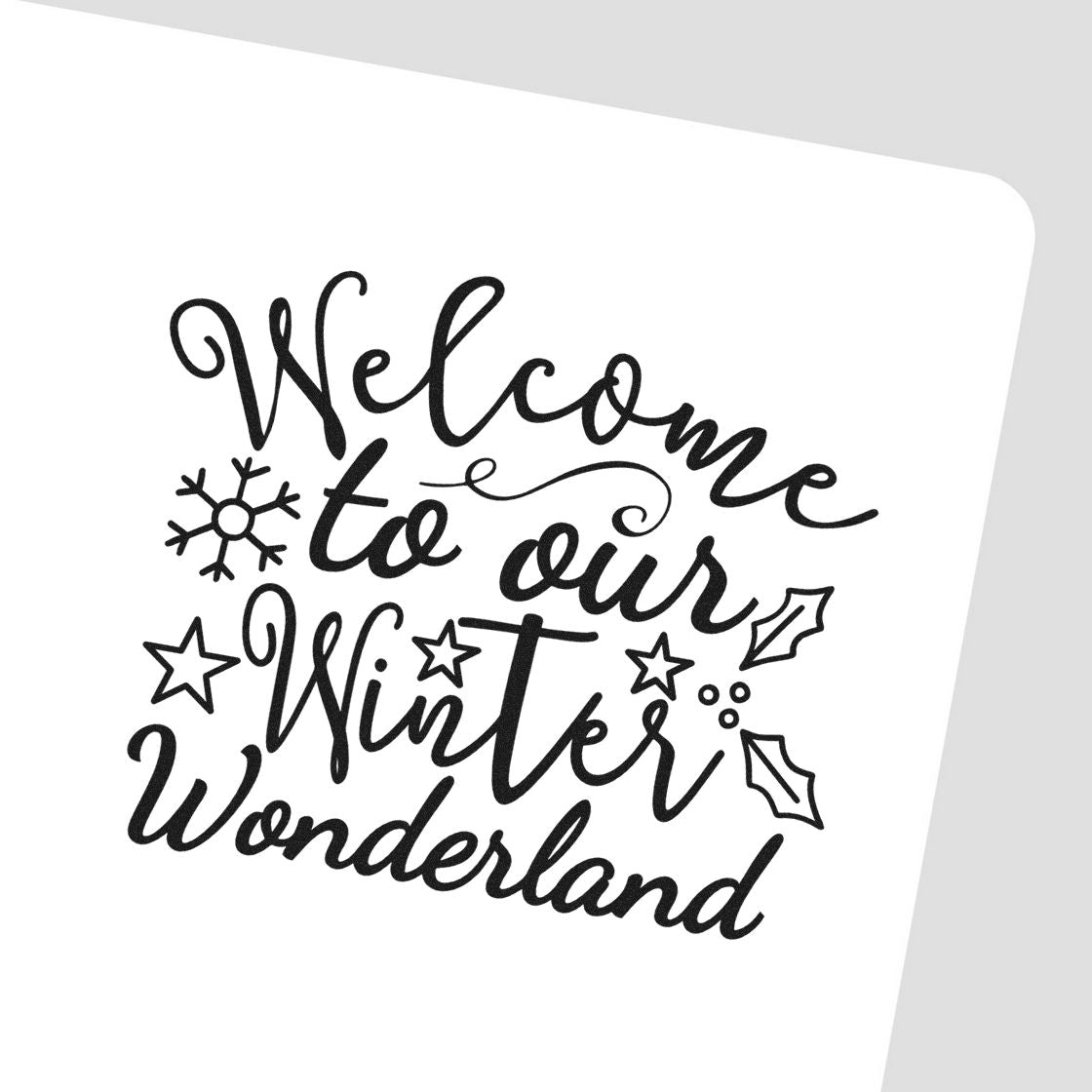 Black winter-themed welcome stamp and seal with script Welcome to our Winter Wonderland, snowflake, stars, and holly on white background.