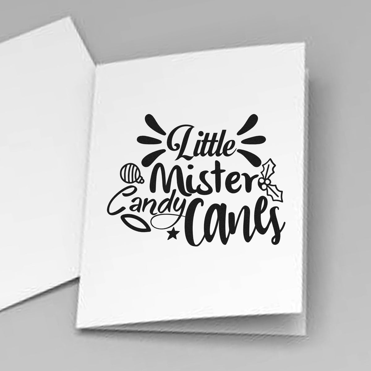 Black holiday stamp design reading Little Mister Candy Canes on white seal cards with ornament and holly accents.