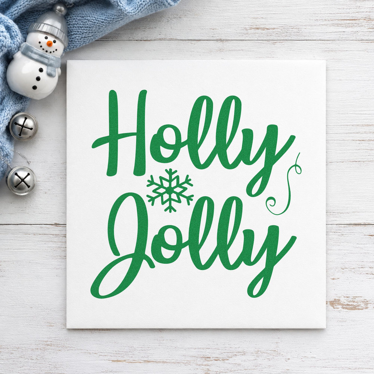 Holly Jolly Snowflake craft stamp imprint in green ink on a handmade project, one idea being paired word tags.