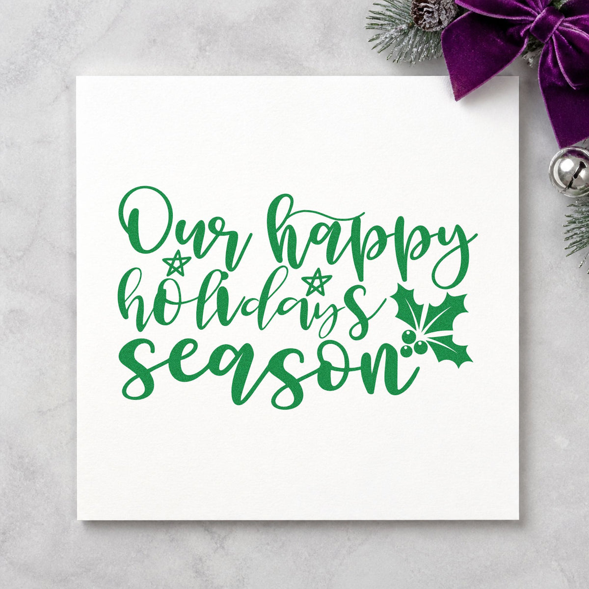 Our Happy Holidays Season craft stamp imprint in green ink on a handmade project, one idea being from us gift tags.