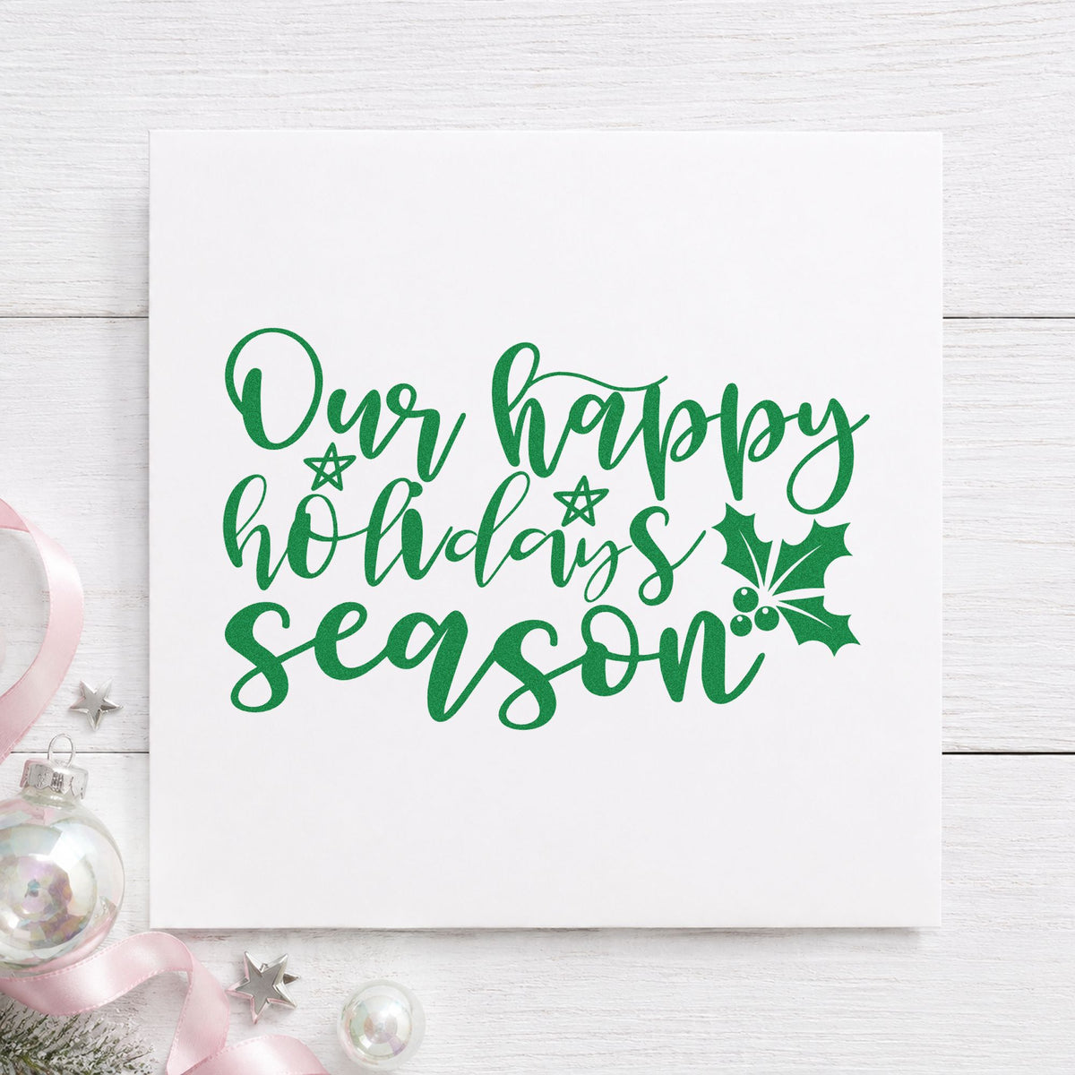 Our Happy Holidays Season craft stamp imprinted in green ink on paper, a design suited to framed family room.