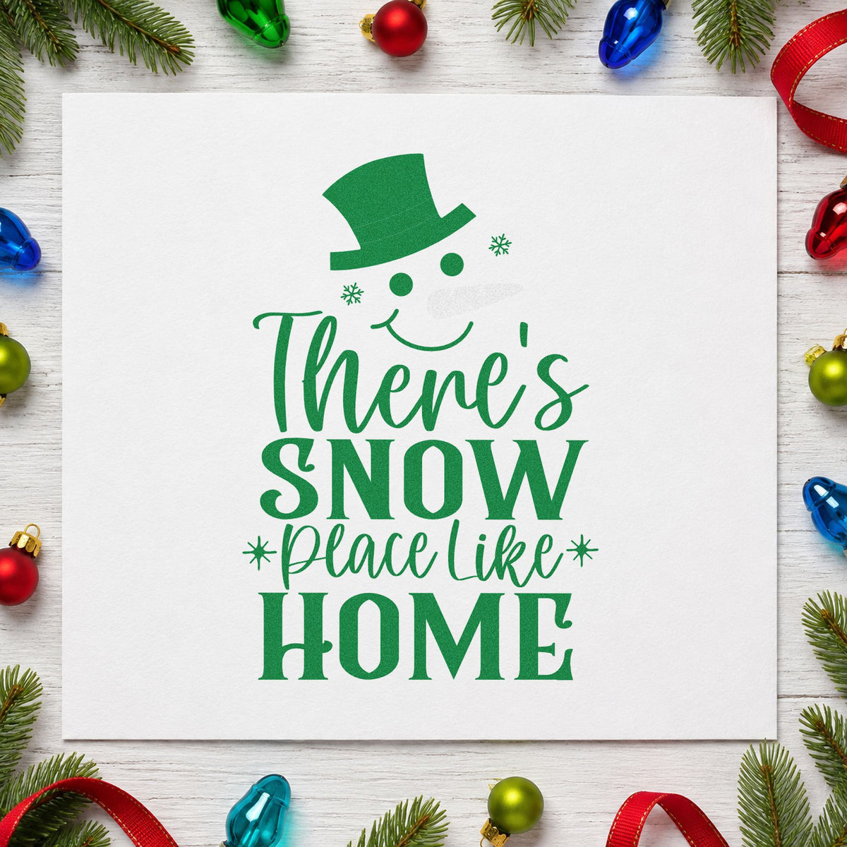 Snow Place Like Home craft stamp imprint in green ink on a handmade project, one idea being housewarming tags.
