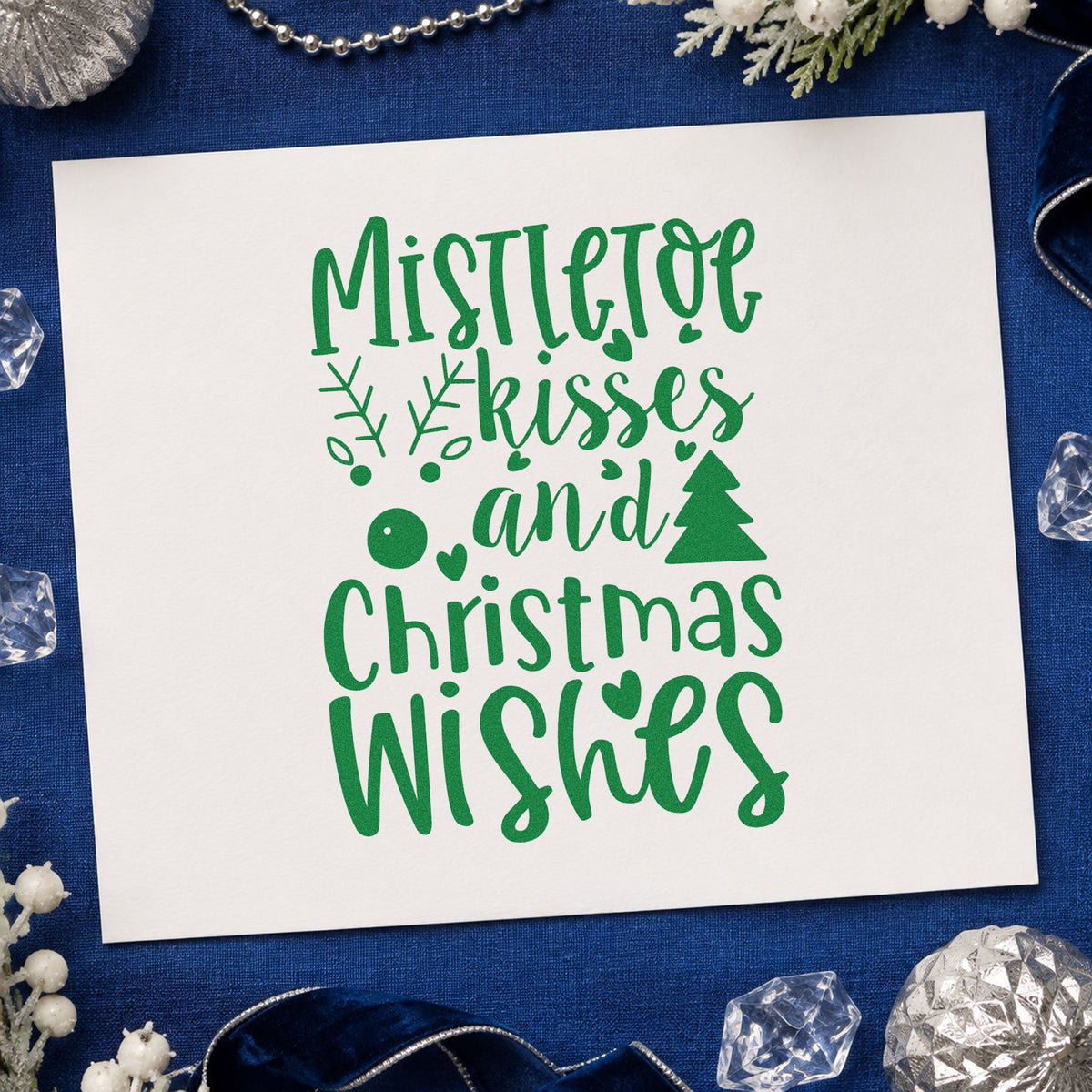 Mistletoe Kisses Christmas Wishes craft stamp imprint in green ink on a handmade project, one idea being favor sachet tags.