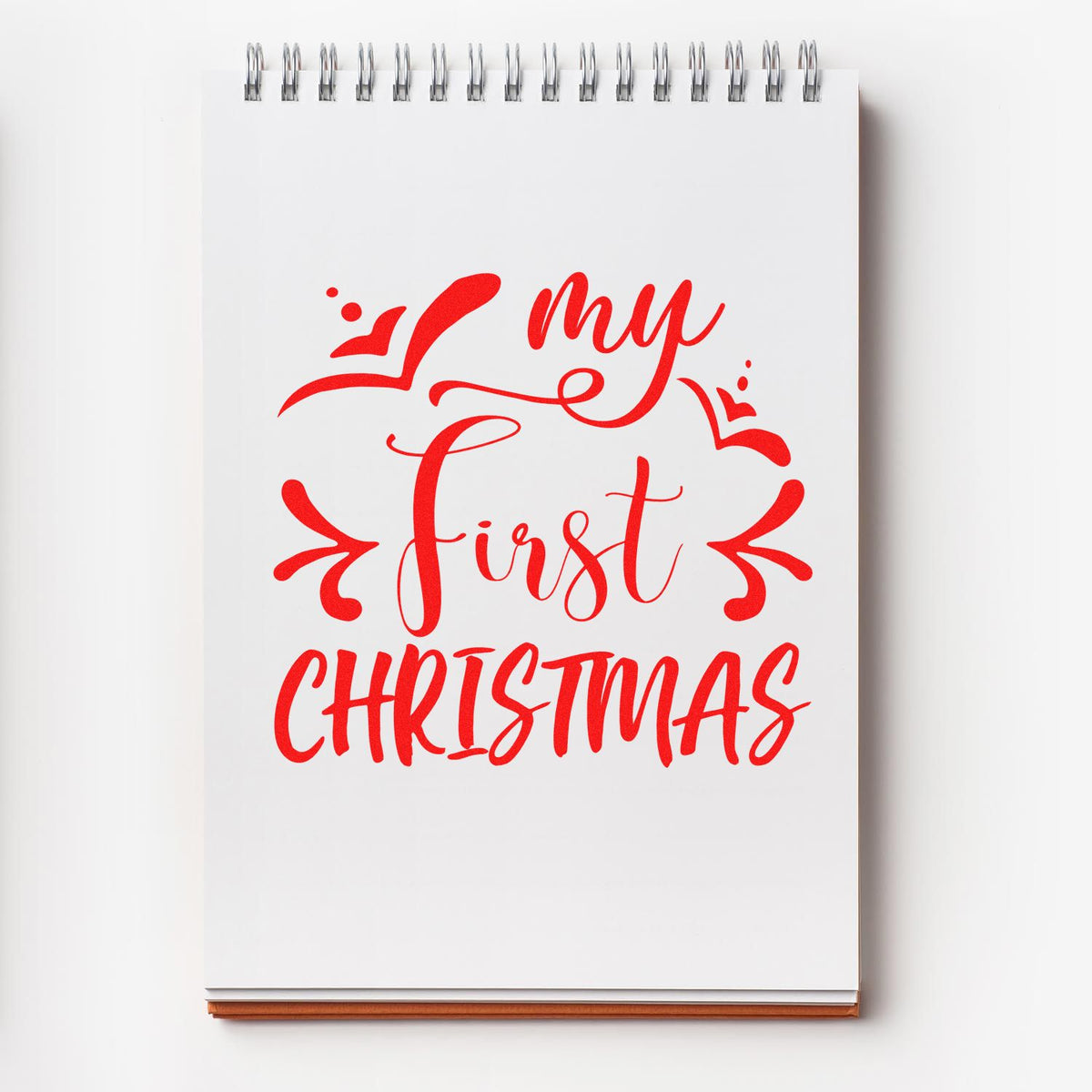 My First Christmas rubber stamp shown in red ink, stamped for projects such as debut album page.