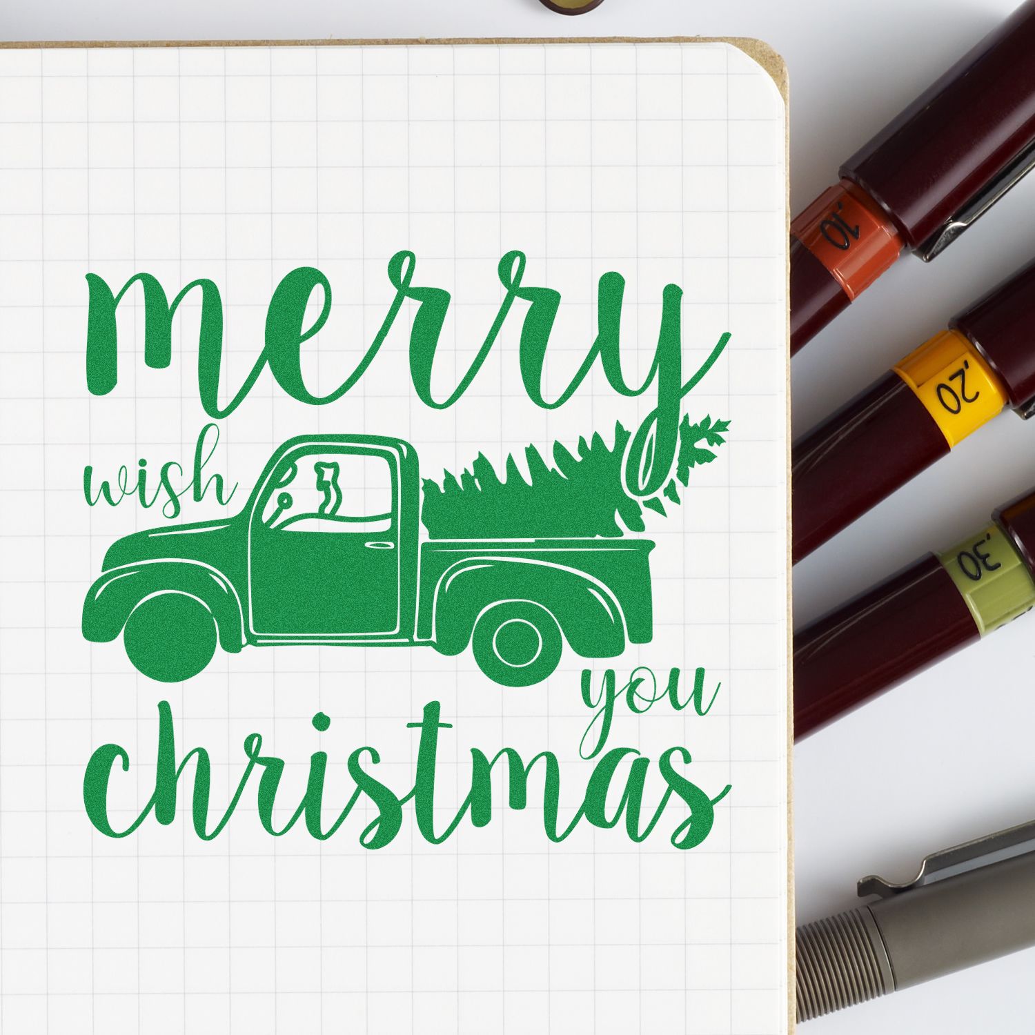 Green Merry Christmas pickup truck stamp and seal set with tree, shown beside colored marker-style seals.